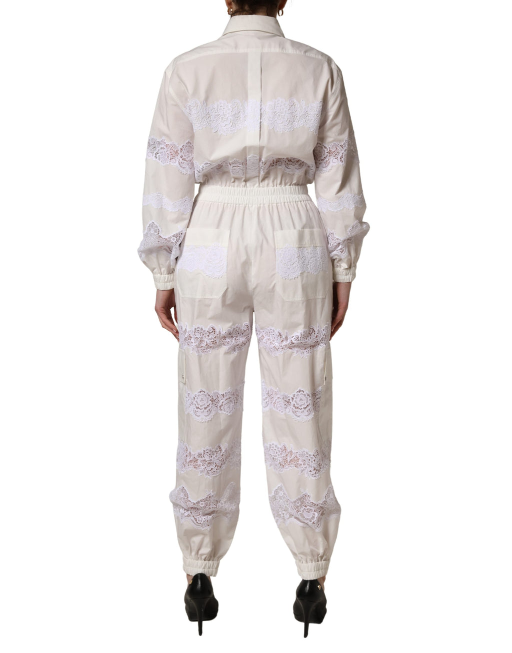 Dolce & Gabbana Jumpsuit aus weißer Baumwolle mit Spitzendetails und langen Ärmeln