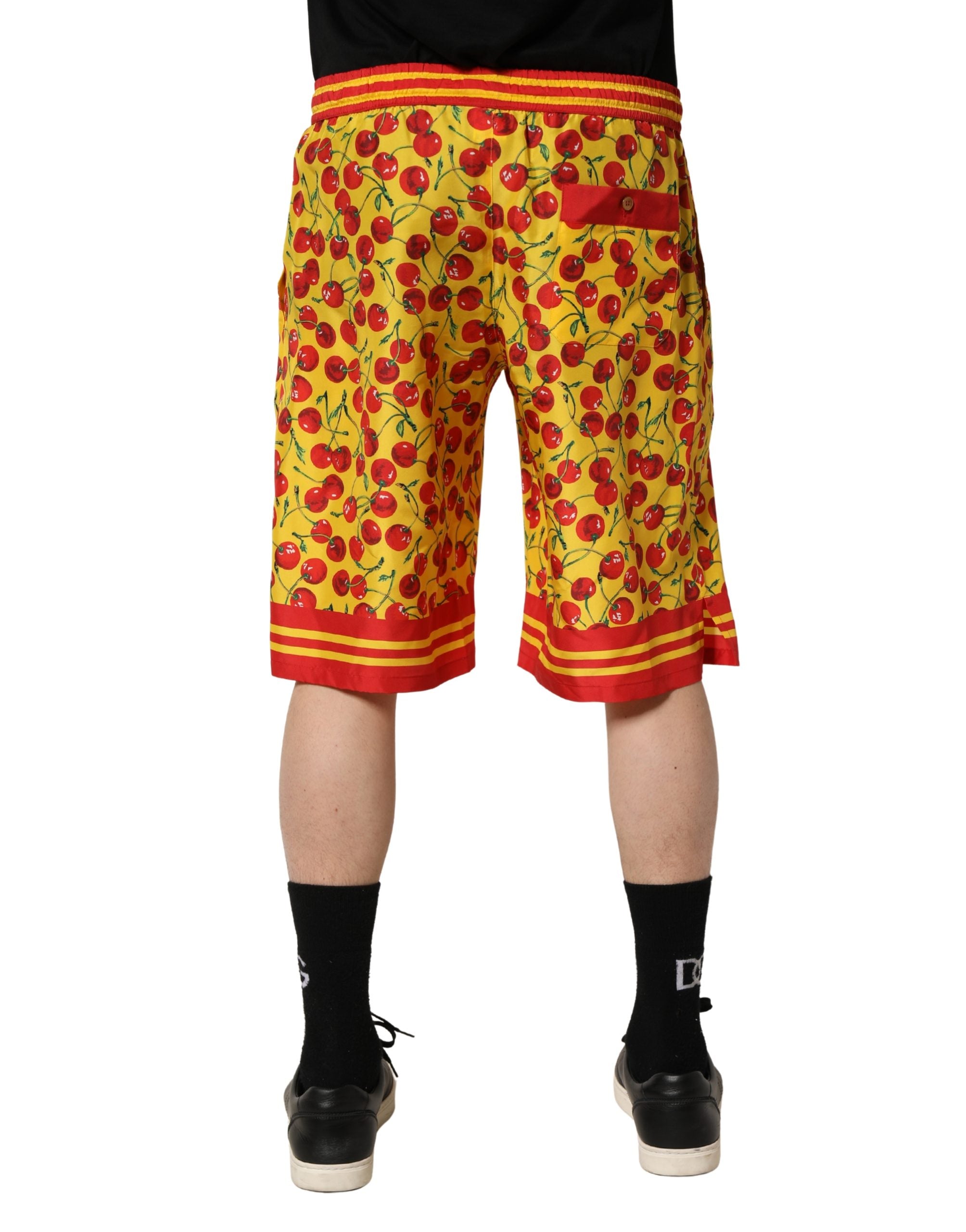 Dolce & Gabbana Bermuda-Shorts aus Seide mit gelbem Kirschen-Print