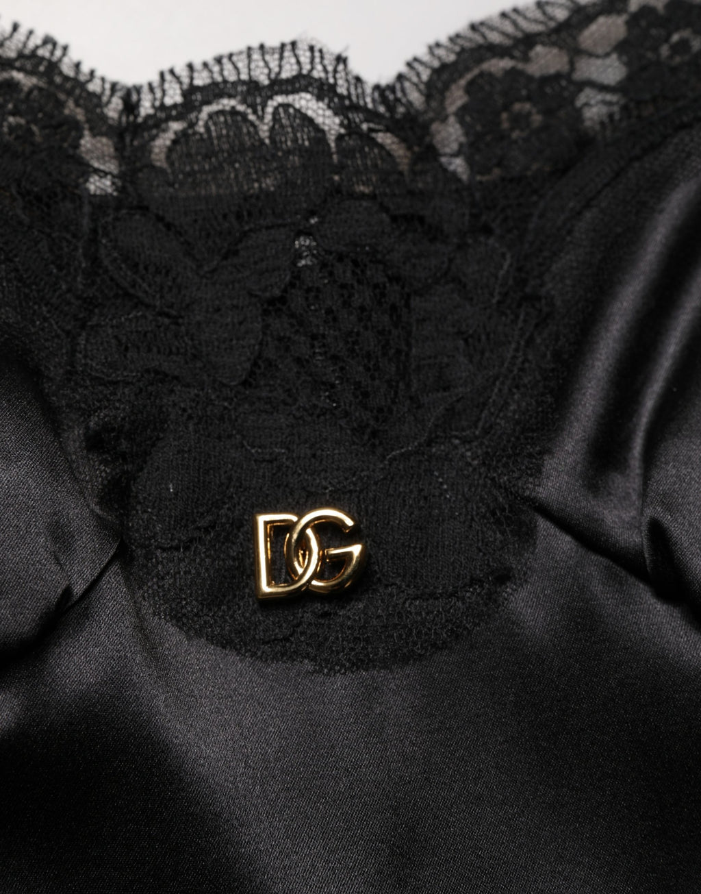 Dolce & Gabbana Schwarzes ärmelloses Minikleid aus Seidensatin mit Spitze