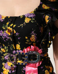 Dolce & Gabbana Midi-Kleid aus Seide mit schwarzer und violetter Kristallbrosche