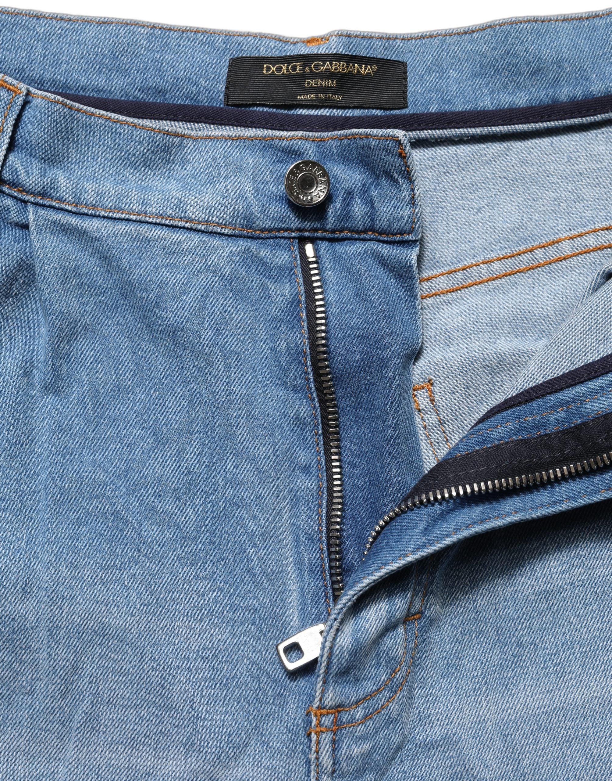 Dolce & Gabbana Blaue distressed Jeans aus Baumwoll-Denim mit Faltenlegung