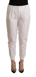 White tapered cotton trousers with a mid-rise waist