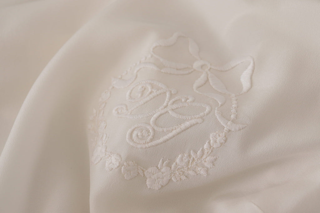 Dolce & Gabbana White Silk Blouse with DG Logo Embroidery and Long Sleeves