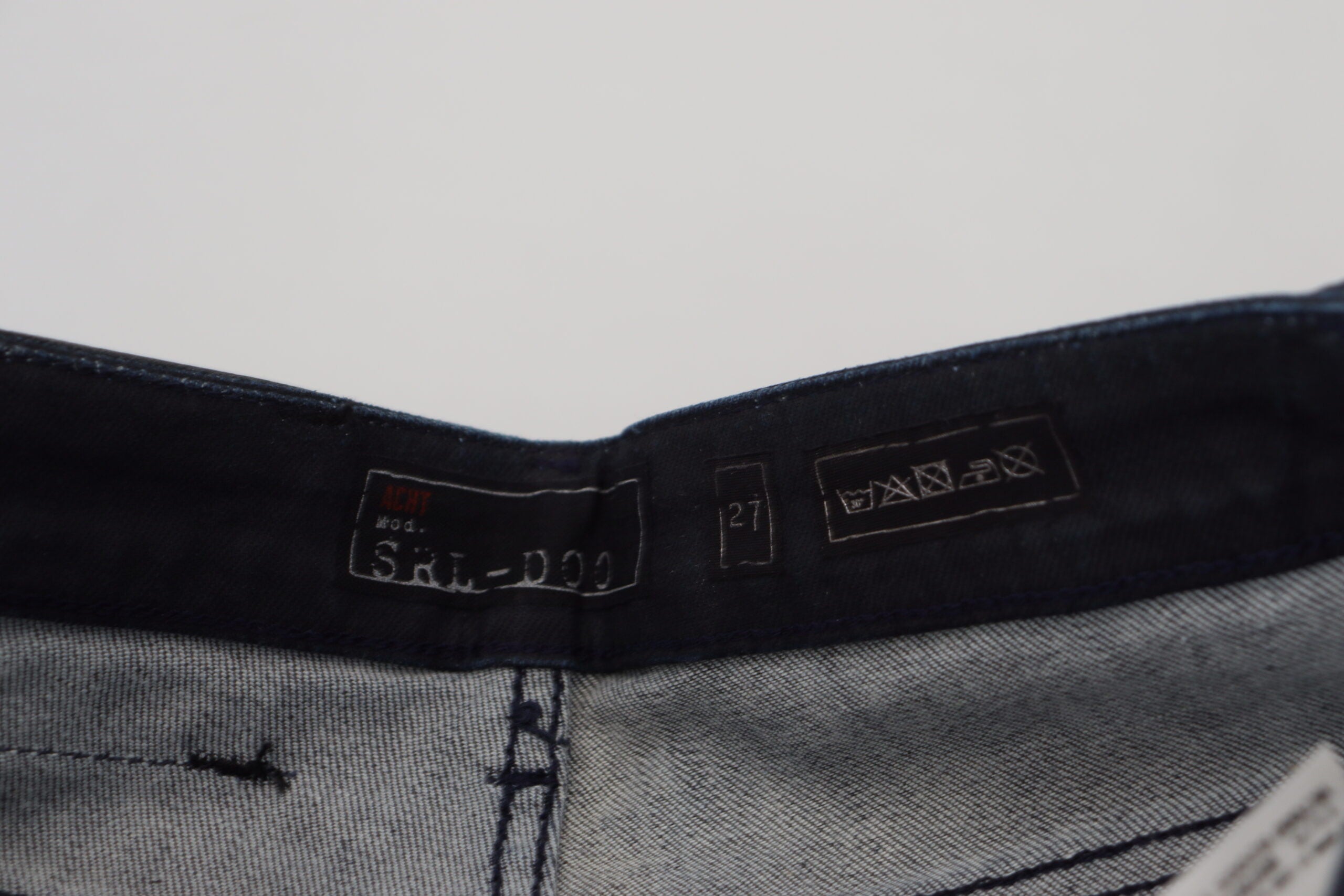 Eight blue washed low-rise slim-fit jeans in cotton denim