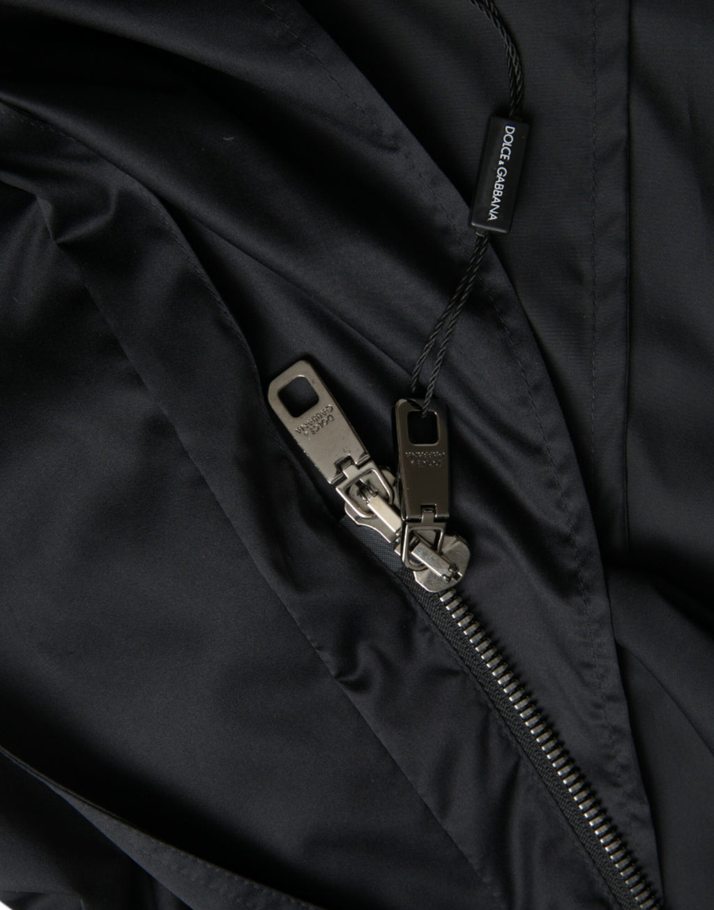 Dolce & Gabbana Schwarze lange Windbreaker-Jacke mit Kapuze aus Polyester