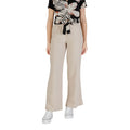 Only beige linen trousers in a casual look