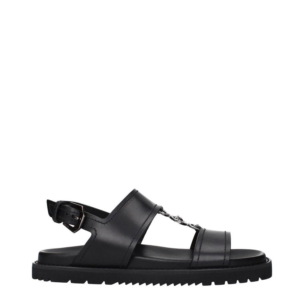 Versace Schwarze flache Sandalen aus Leder