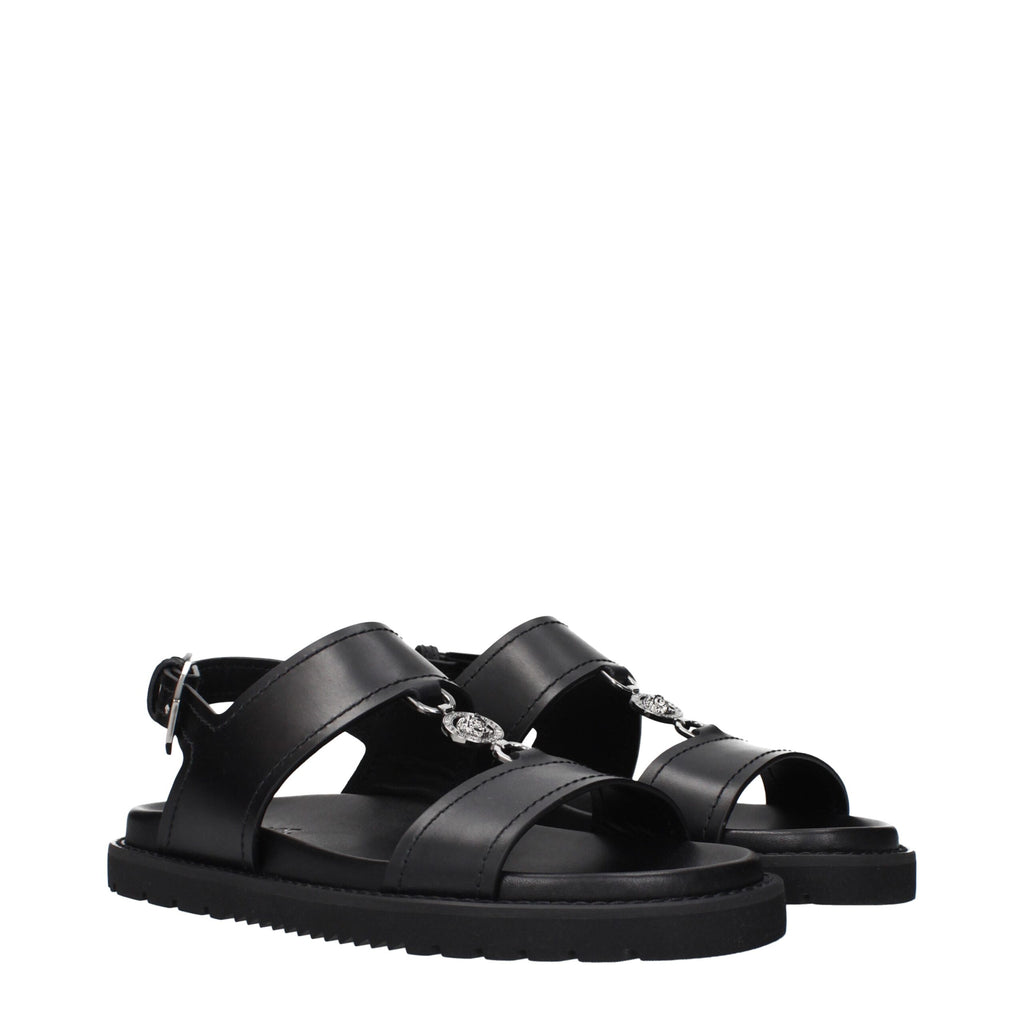 Versace Schwarze flache Sandalen aus Leder