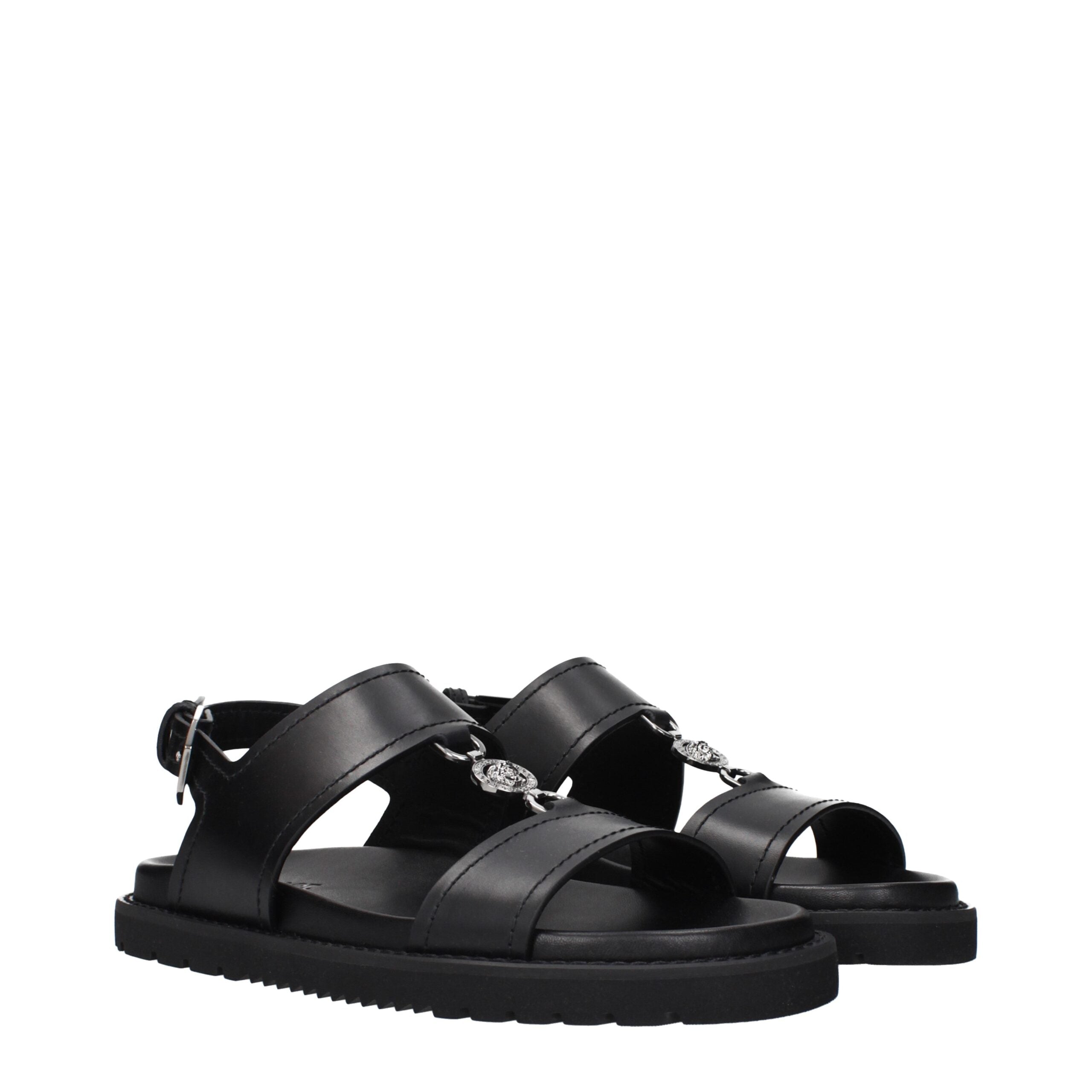 Versace Schwarze flache Sandalen aus Leder