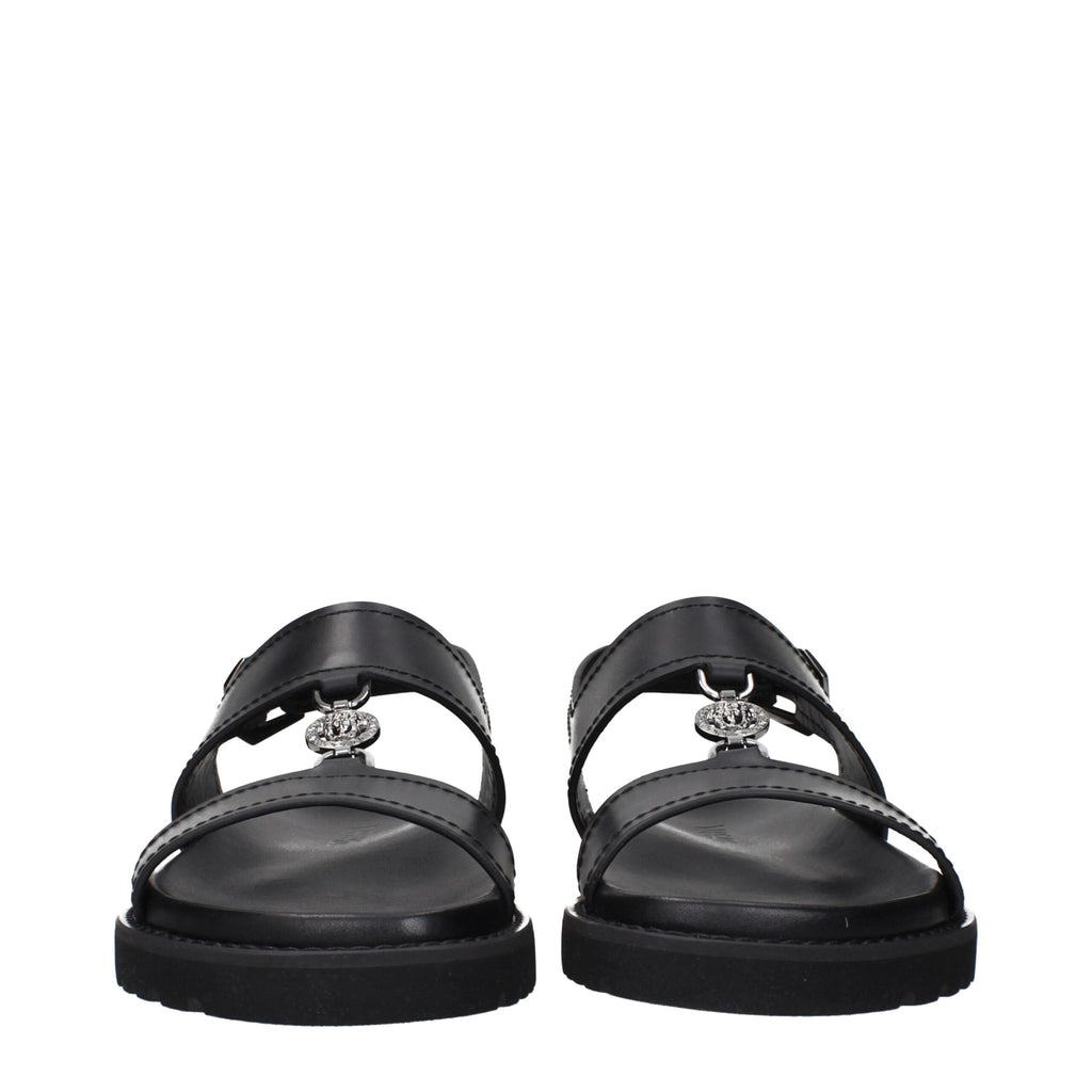 Versace Schwarze flache Sandalen aus Leder
