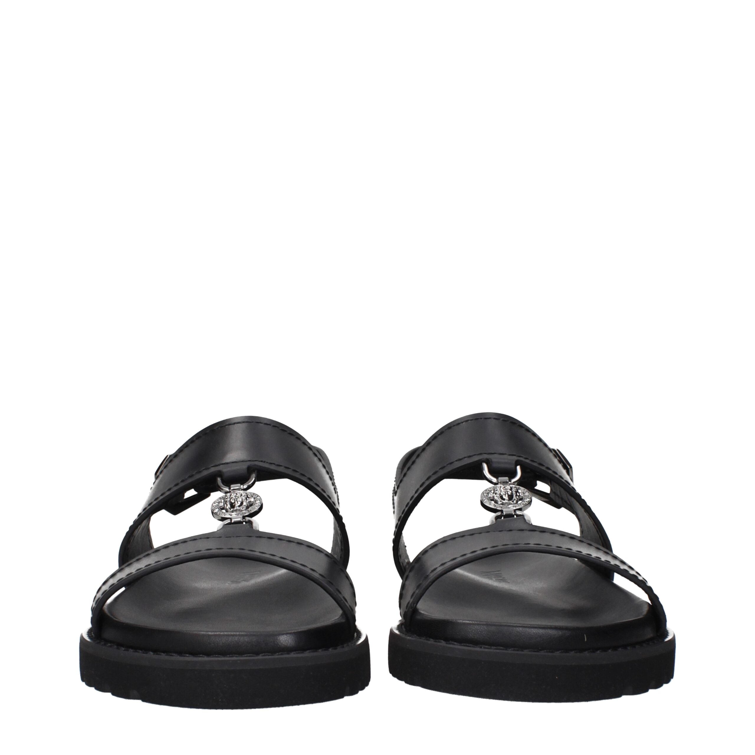 Versace Schwarze flache Sandalen aus Leder