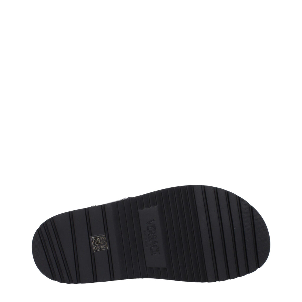 Versace Schwarze flache Sandalen aus Leder